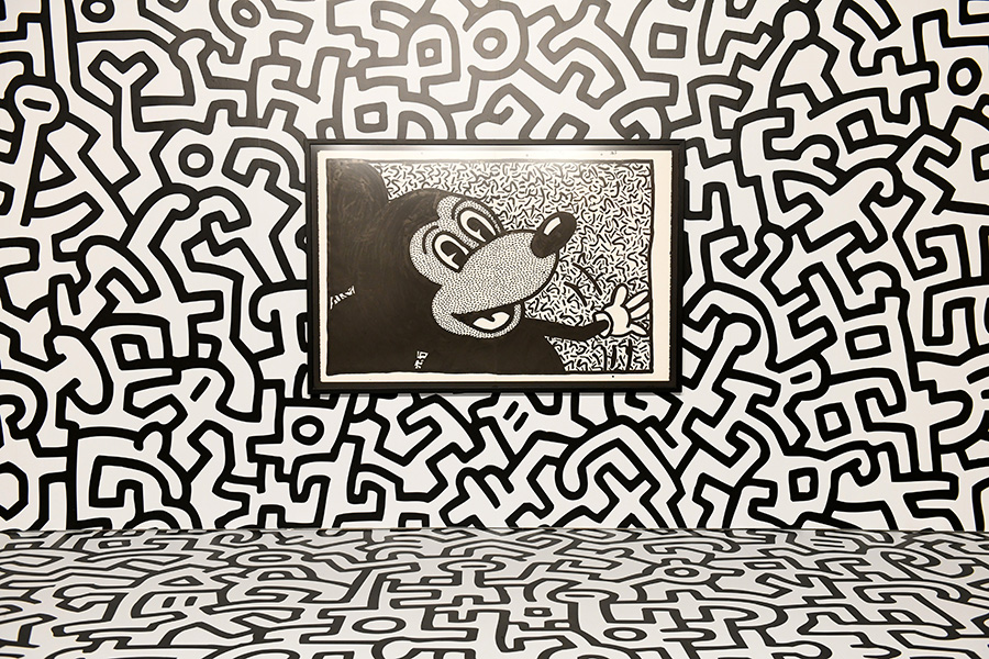 NEW YORK, NY - NOVEMBER 06: Art by Kieth Haring. Mickey: The True Original Exhibition celebrates 90 years of Mickey Mouse’s influence on art and pop culture. Opening November 8, 2018 through February 10, 2019, this immersive experience is inspired by Mickey’s status as a ‘true original’ and his consistent impact on the arts and creativity in all its forms. Guests will have the chance to explore the 16,000 square-foot exhibition featuring both historic and contemporary work from renowned artists. The exclusive pop-up retail shop carries special merchandise and offers customization. (Photo by Craig Barritt/Getty Images for Disney)